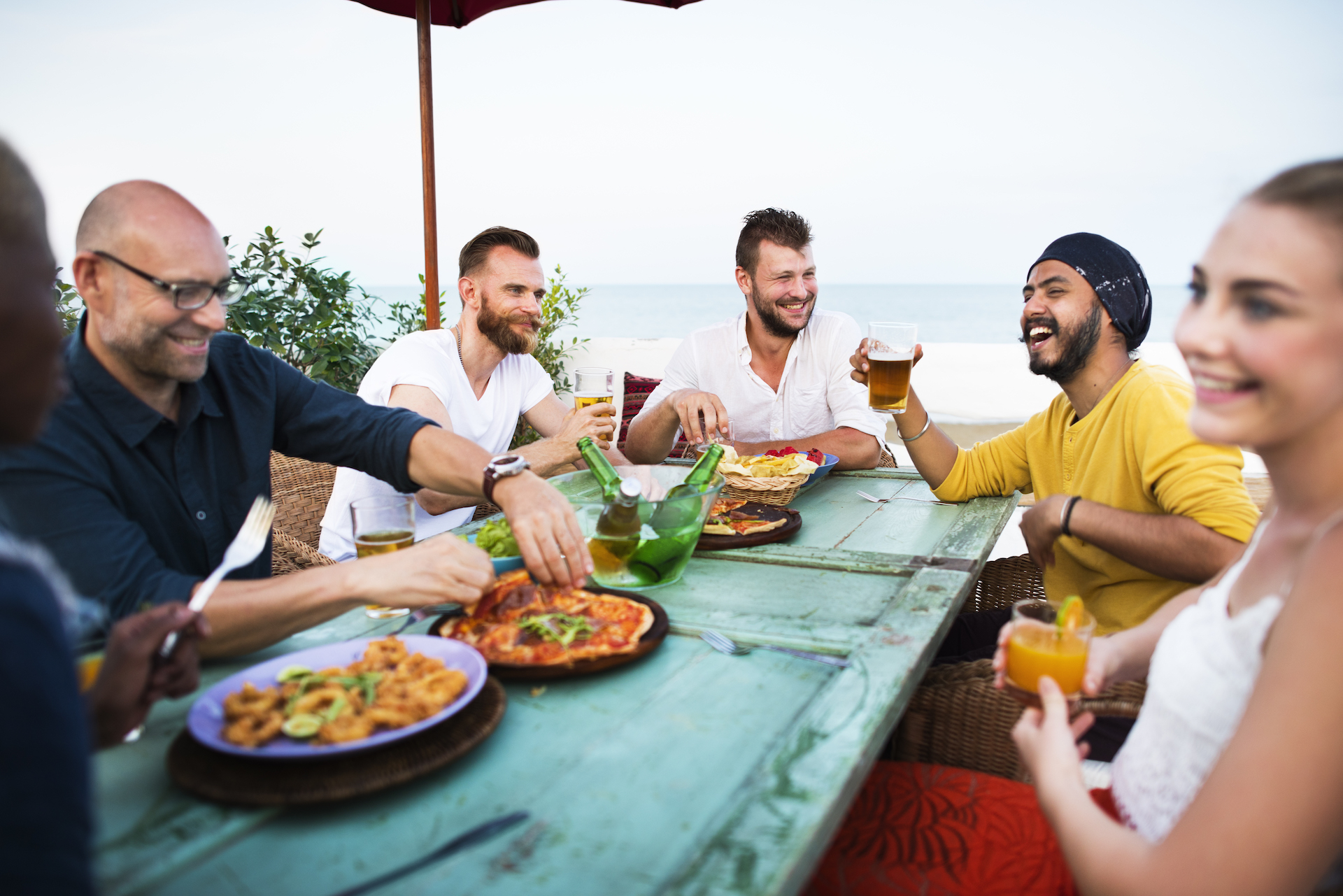 Image of friends enjoying food and drinks at a hotel in Fort Pierce